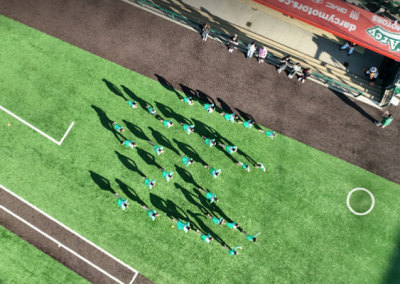 Drone footage of high school team sports.